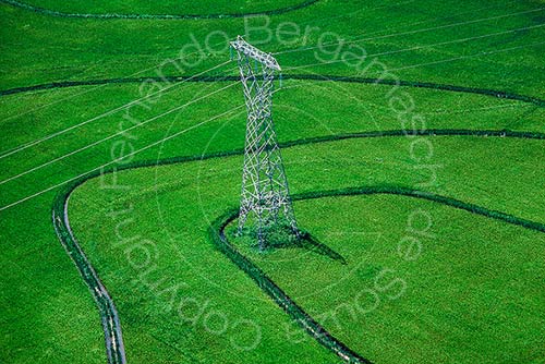 Transmission tower in rice paddy